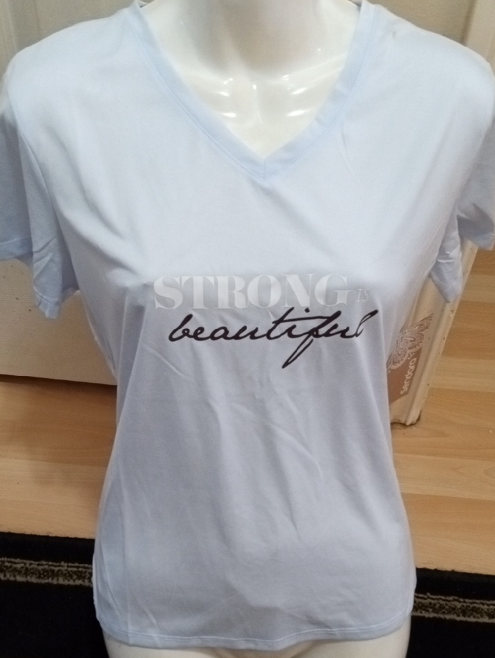 $5>>Sendra Light Blue V-Neck Tee with 'Strong is Beautiful' Graphic